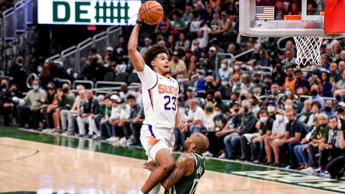 Suns' Cam Johnson dunks on Bucks' forward PJ Tucker